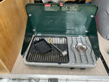This Coleman propane grill stove is ready for outdoor cooking, ideal for an RV rental adventure.