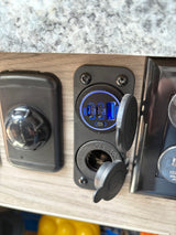 RV rental's convenient charging station: dual USB-C PD, USB-A QC3.0, and 12V socket, ready to power your devices.