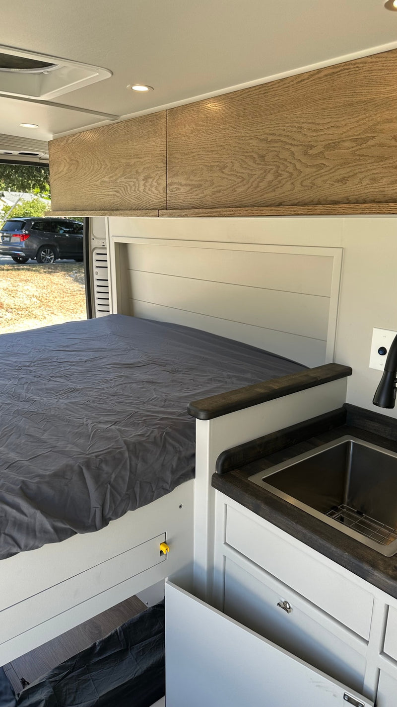  and battery monitor showing 100%.|RV rental interior with a clever — photo 9