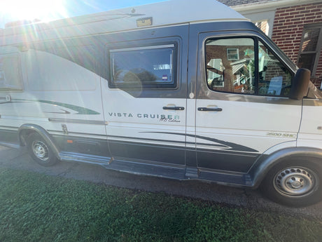 White and gray Vista Cruiser MB Edition Mercedes Sprinter camper van, ideal for an RV rental adventure.