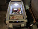 RV rental setup: A portable electric cooler with fresh produce (47F) and "Shaka Moa Eggs," powered by a PROwatt SW inverter.