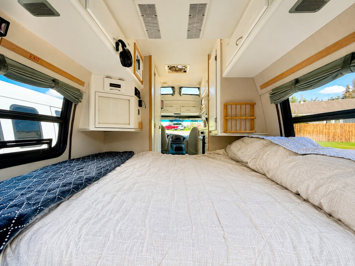 Spacious RV rental bedroom featuring a large