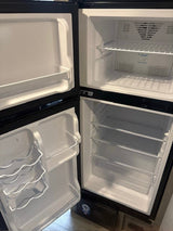  and 56" dinette.|Inside a modern RV rental: a compact kitchen
