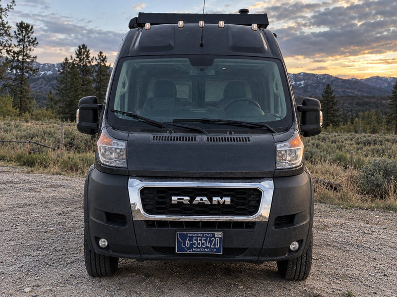  and practical under-bed storage. Perfect for road trips.|Explore with an RV rental! A gray camper van sits before majestic — photo 9