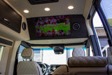Large screen showing American football in a luxury RV rental. Features comfortable quilted seats & modern design.
