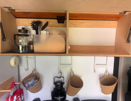  and a multi-spice shaker.|RV rental drawer featuring space-saving pots with lids