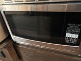 Compact stainless steel High Pointe microwave, ideal for an RV rental, featuring a convection oven and full control panel.