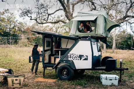 Explore the outdoors with this unique RV rental: a Tiger Moth off-road trailer with a rooftop tent & family.