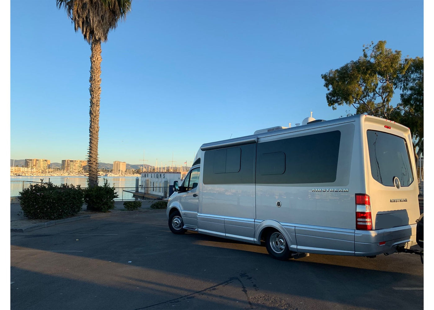  with a silver RV on sand — photo 7