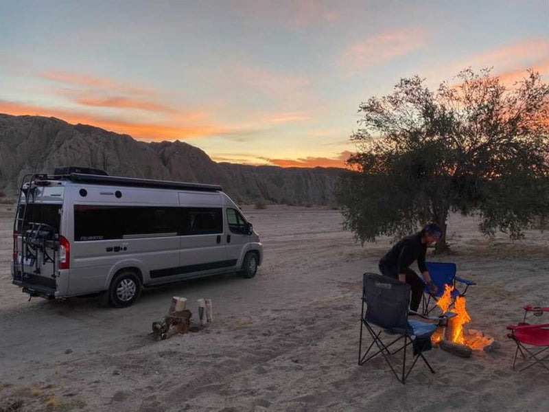  and a view of the driver's cockpit.|Compact RV rental kitchen with microwave — photo 4