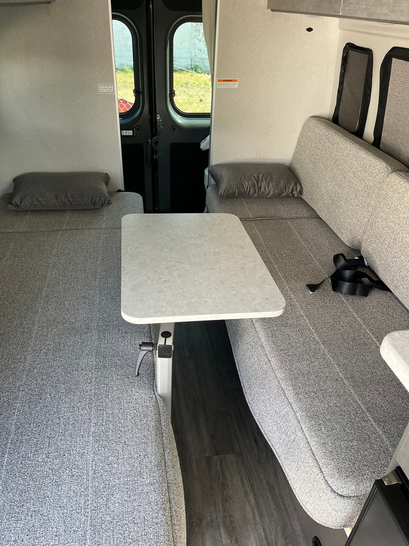  perfect for travel adventures.|Rear underside of an rv rental showing its wastewater holding tank connection and a caution label for the tank flush valve near the tire.|RV rental showing propane connections — photo 18