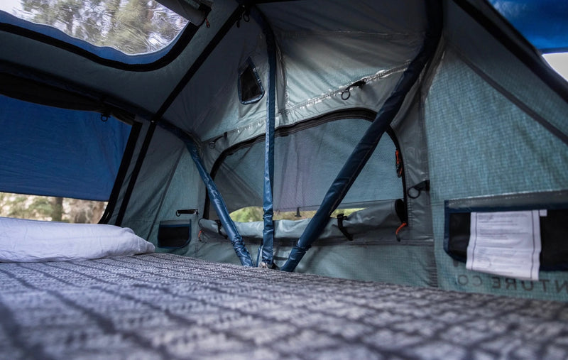 RV rental sleeping area: a cozy tent interior with a bed, mesh windows & outdoor views. — photo 18