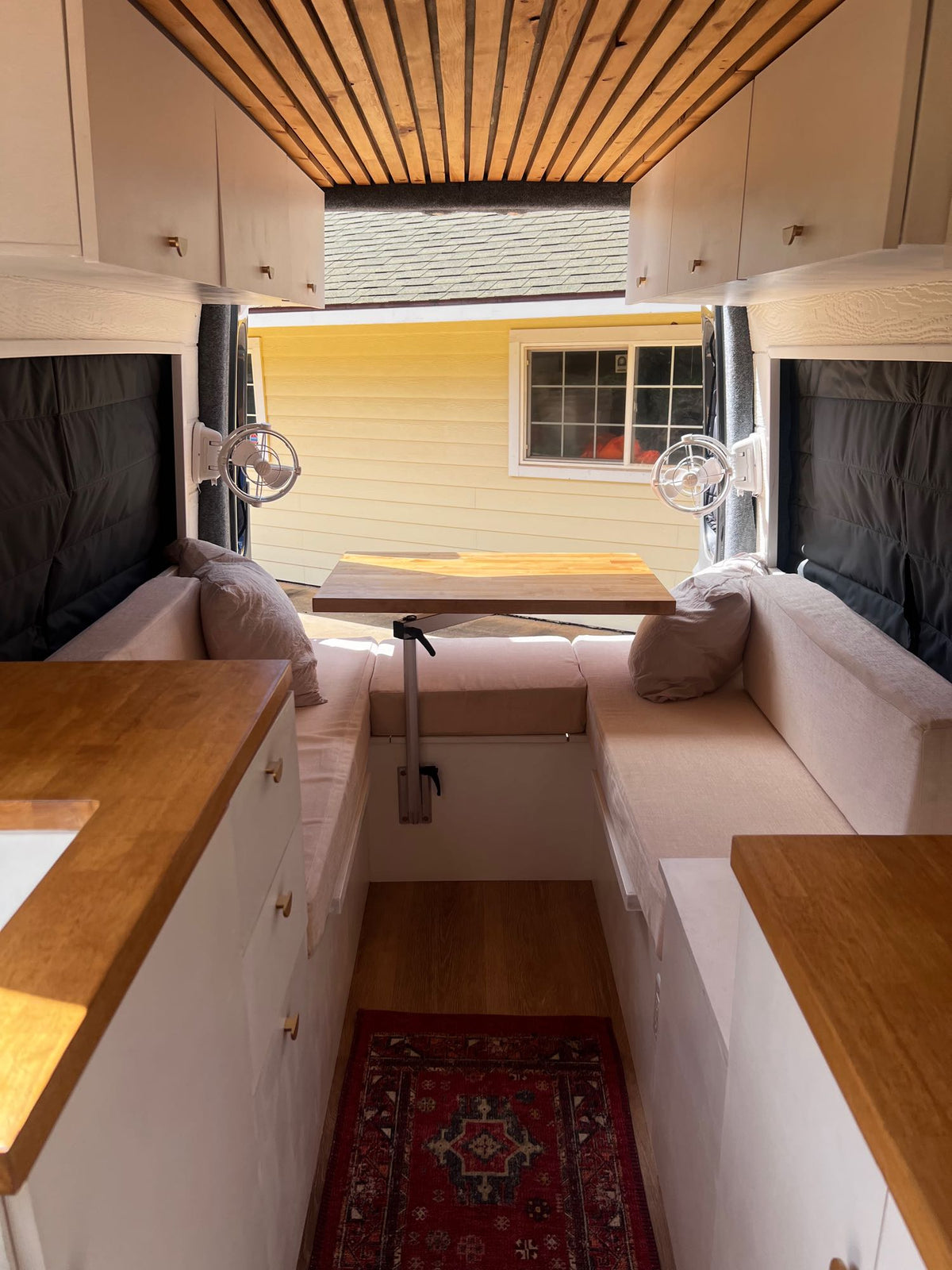  and stunning ocean sunset views from the window.|Luxurious RV rental interior featuring a bright kitchen — photo 5