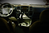 Inside a Ram **rv rental**: Driver's view of the dashboard, featuring steering wheel, infotainment display, gear shifter, and climate controls.