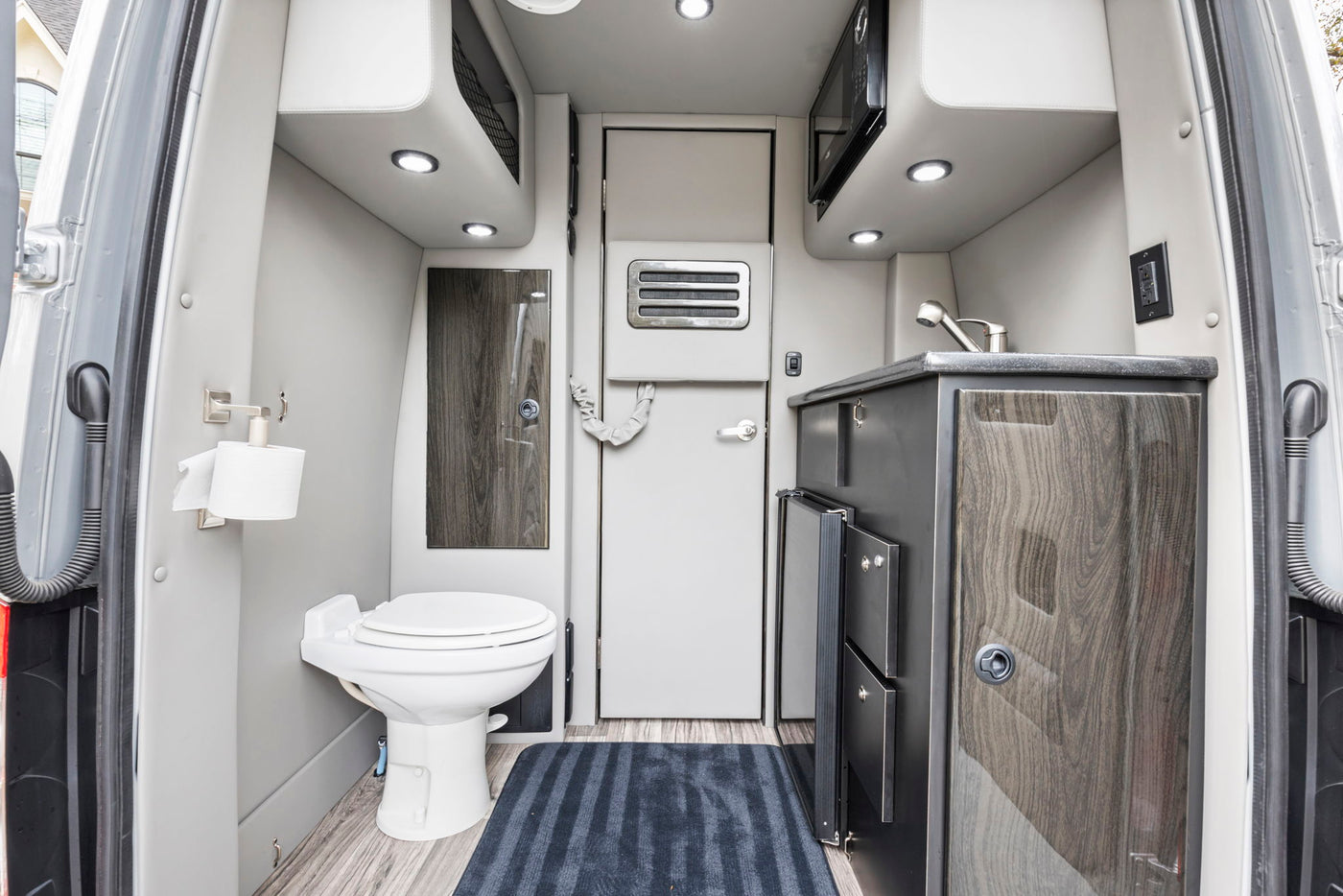  and smart controls offer ultimate travel comfort.|Spacious luxury rv rental interior with quilted seating — photo 10