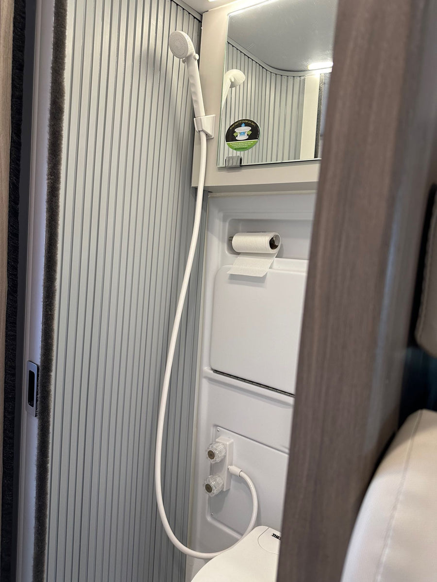  and front cockpit. Ready for travel!|Adventure awaits with this grey RV rental camper van