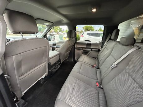 Spacious, clean grey rear seats in a modern pickup truck. Ready for your rv rental road trip.