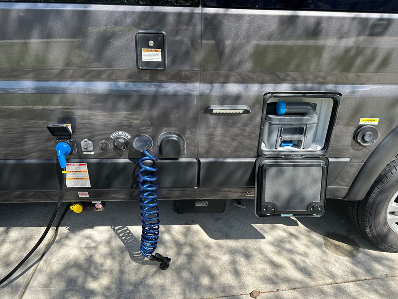  and bright windows.|Bright RV rental interior: view of front cockpit and raised pop-top bed with sky visible — photo 9