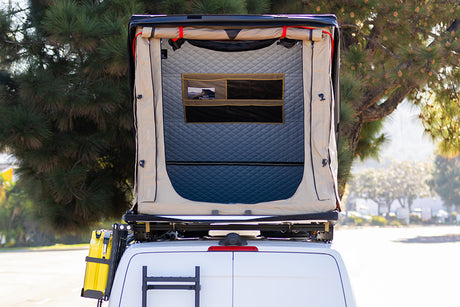 Rear view of an RV rental camper van with an open rooftop tent. Ready for your camping adventure.