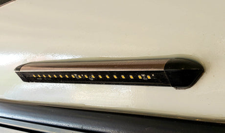Exterior LED light bar on an RV rental. Yellow LEDs provide bright outdoor lighting for camping.