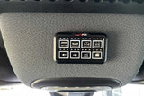 An sPOD auxiliary switch panel for vehicle lights (bar, bumper, ditch) and compressor, commonly found in an RV rental.