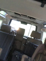Interior view of a spacious RV rental, showing multiple rows of passenger seats for comfortable travel.