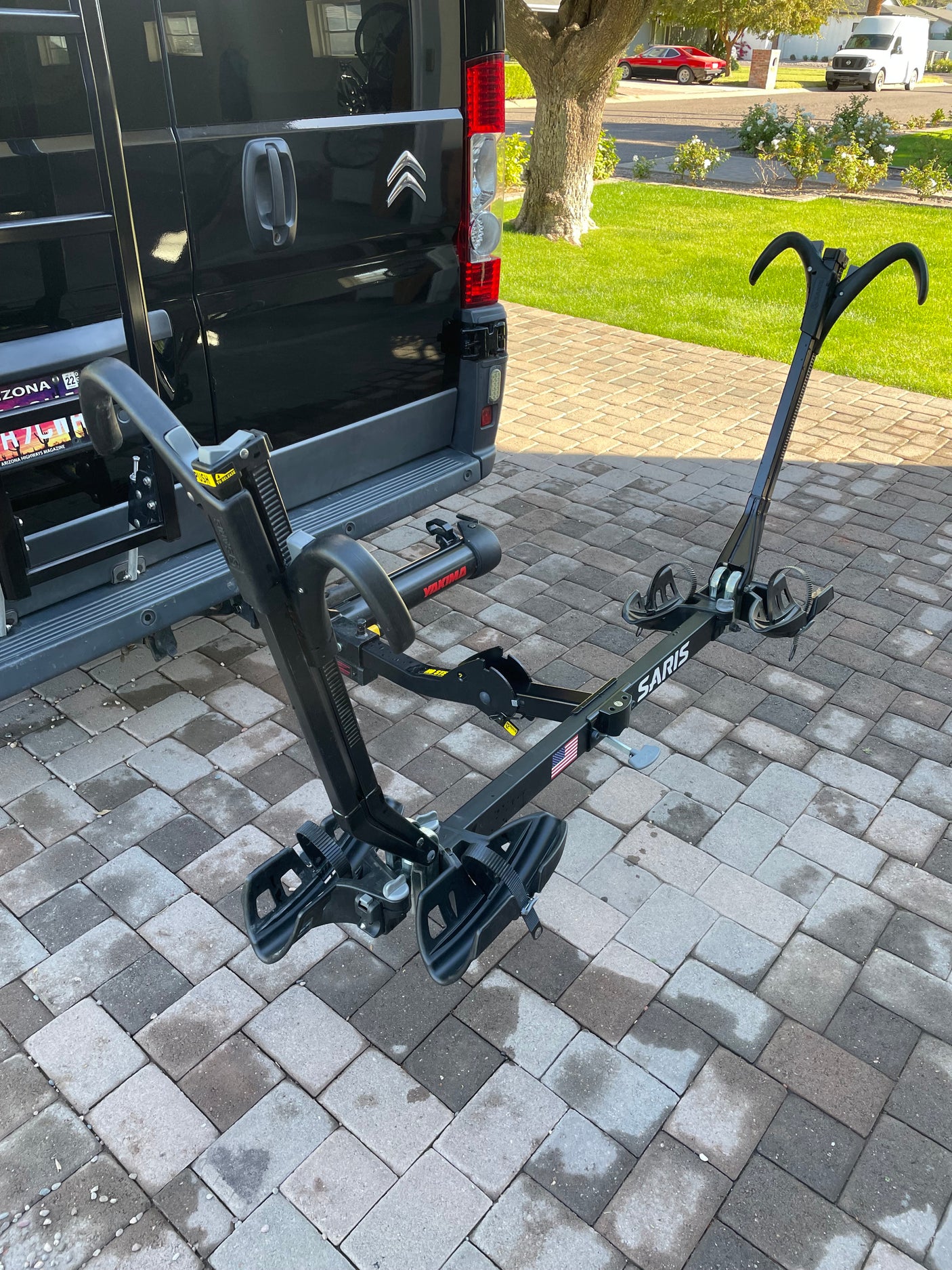 Black camper van with a Saris bike rack, perfect for your next RV rental adventure and exploring the outdoors.