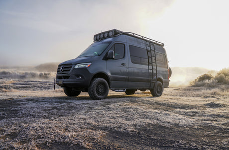 Off-road Mercedes Sprinter camper van on a frosty morning. Ideal RV rental for exploring wintery landscapes.