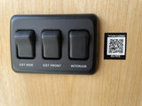 RV rental controls: switches for exterior side, front, and interior lights. Scan QR for owner's manual.