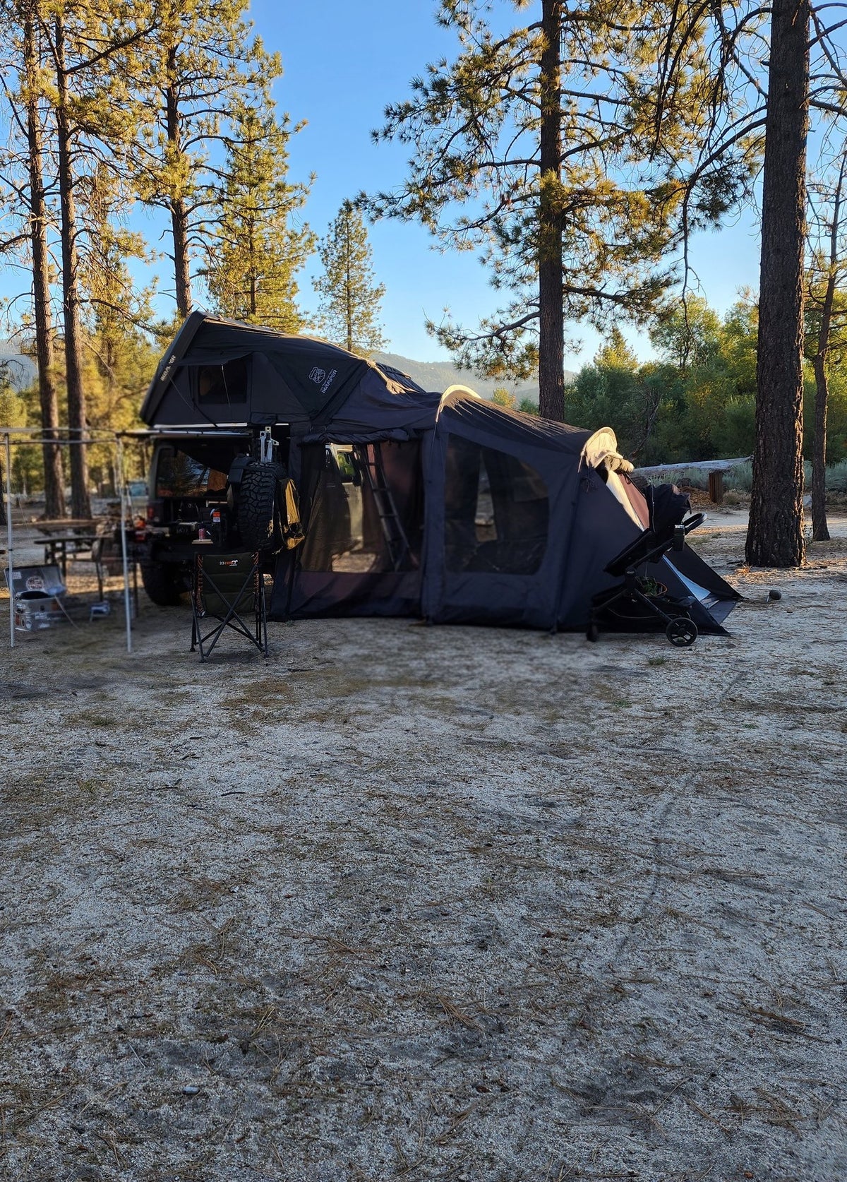 Skycamp 3.0 set up at a pine campsite with the zip-in annex room and side awning deployed — photo 3