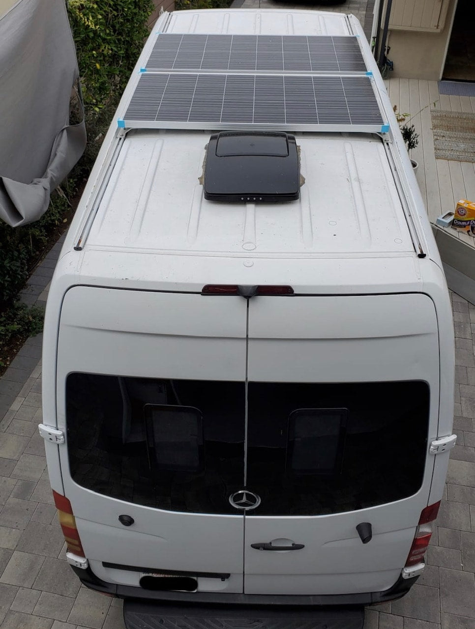 White Sprinter van, ideal for RV rental, with two roof solar panels & vent. Ready for camper adventures. — photo 11