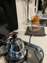 Morning coffee in an RV rental: A gooseneck kettle on the stovetop next to a Chemex pour-over coffee maker.