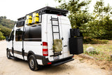 Adventure-ready white Sprinter van rv rental, showcasing side-mounted jerry cans, traction boards, and rear storage.