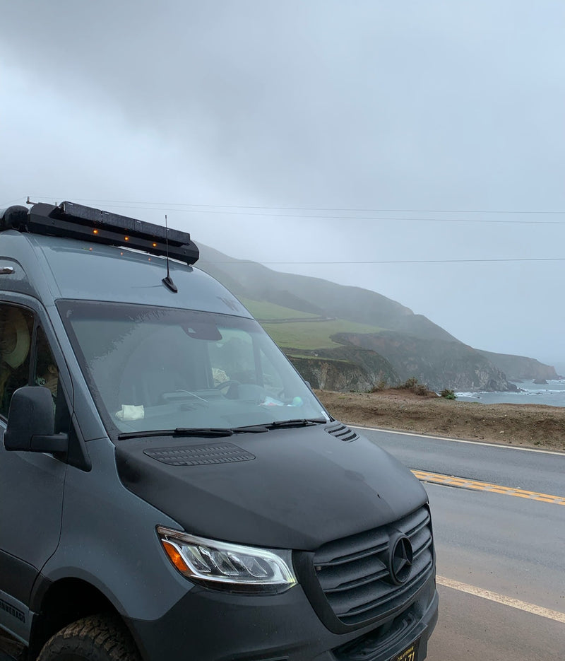  and a window view of nature.|Experience adventure with this gray custom camper van rv rental! Enjoy the open side — photo 6