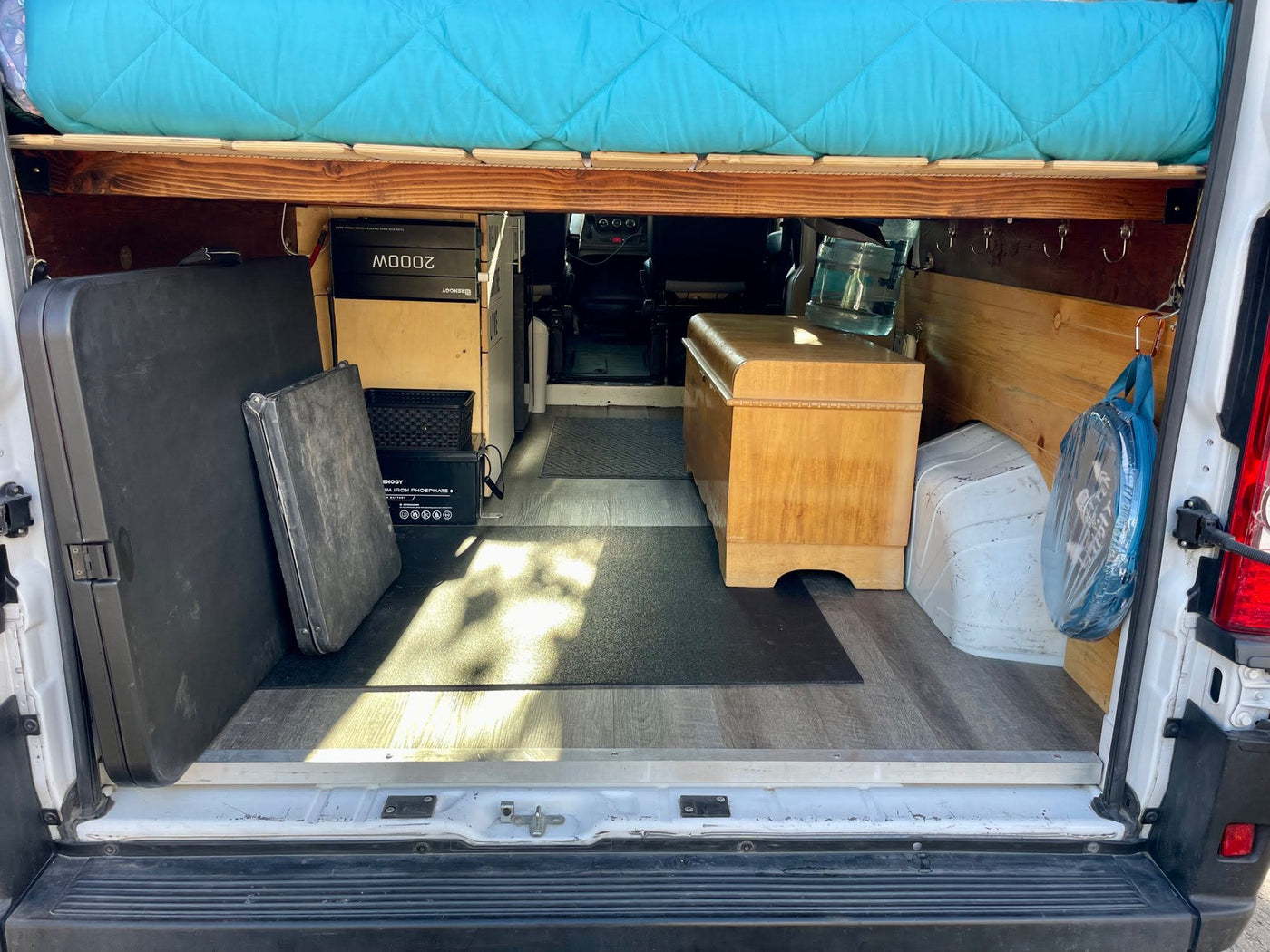  and a view of the camping setup.|RV rental van interior: driver's view of dashboard with steering wheel — photo 17