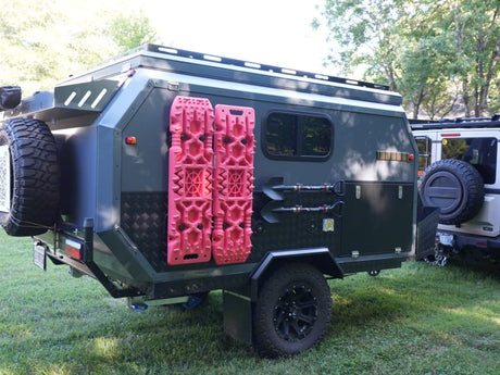 and sleek wood-grain cabinets.|Overland trailer with solar panels & awning
