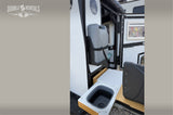 Explore this rv rental's convenient outdoor kitchen, featuring a pull-out sink and mounted water canister for easy camping setup.