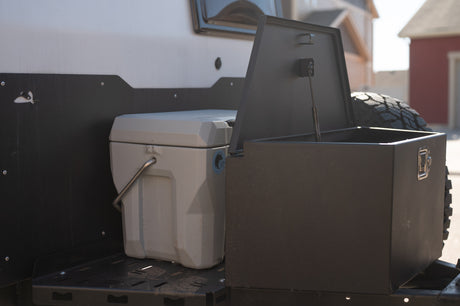 RV rental: Rear platform with a cooler and open storage box. Perfect for your outdoor adventure gear.