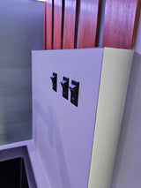 Control features in your RV rental with these three ON/OFF rocker switches, set against a modern panel with wood accents.