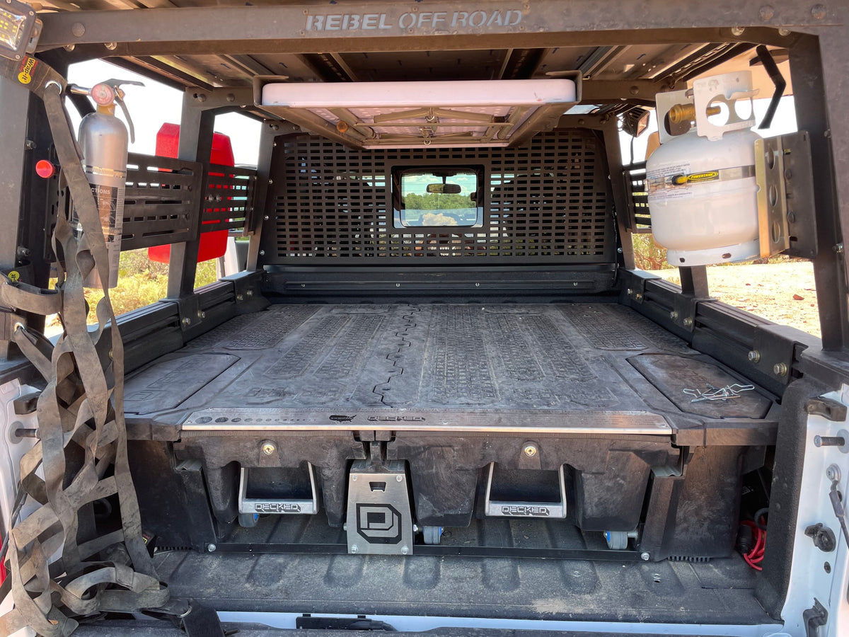  on a rugged desert trail overlooking stunning red rock vistas.|Explore with this RV rental: White Jeep Gladiator with deployed roof-top tent and ladder — photo 14