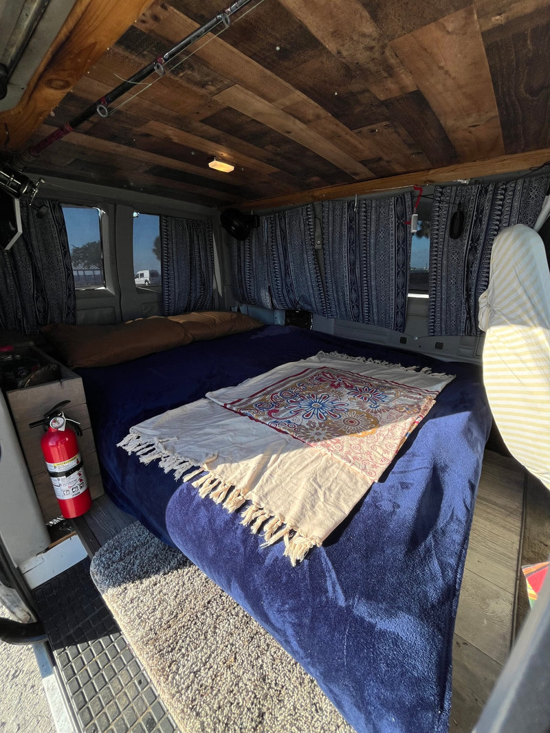  clear day.|Cozy rv rental van interior with bed — photo 8
