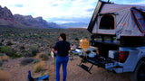 Cooking outdoors from a truck with a rooftop tent. An ideal rv rental for desert overlanding & mountain views.
