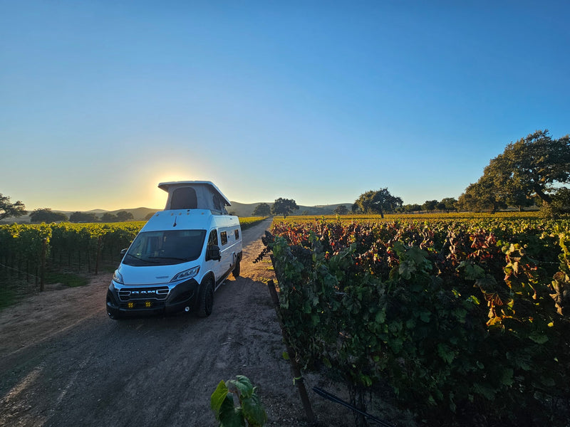  offering a peaceful travel adventure.|White camper van RV rental parked on a scenic — photo 2