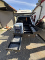 Extendobed truck bed drawer system fully extended out of a Toyota Tundra bed, with the main drawer, lower slide-out tray and the ARB fridge on its slide