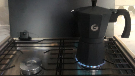 RV rental life: Moka pot coffee brewing on the compact gas stove.
