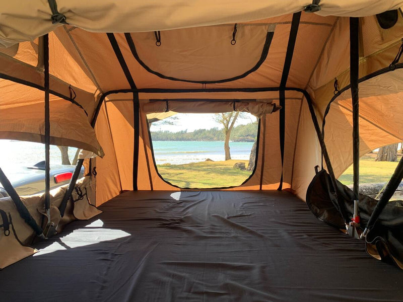  ready for a comfortable camping trip.|Inside a spacious rooftop tent — photo 5
