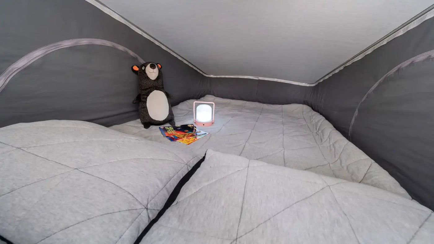  plus comfortable light-colored passenger seats.||Inside this RV rental: a compact kitchen on the left — photo 9