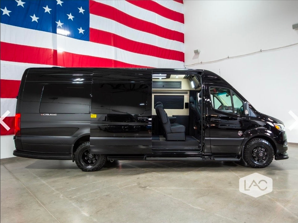  featuring rugged off-road tires.|Black luxury conversion van