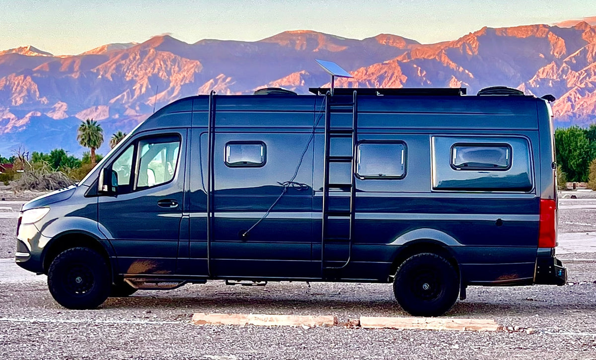 A custom dark camper van