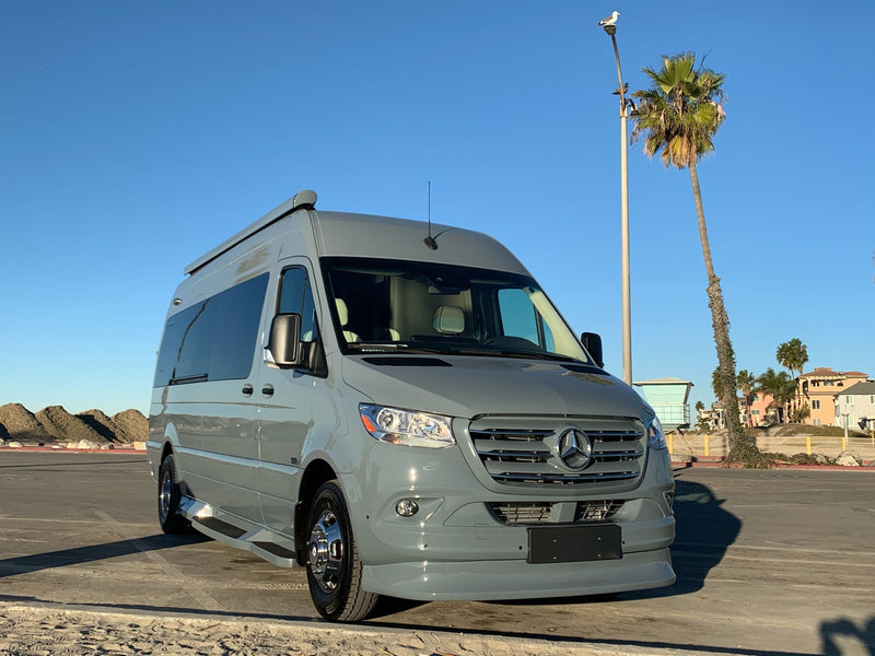  parked by the coast.|Gray Passage RV rental camper van by a sunny beach — photo 8